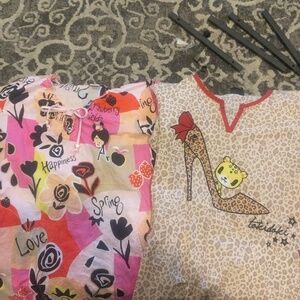 Lot of 2 Koi scrub tops size xs.